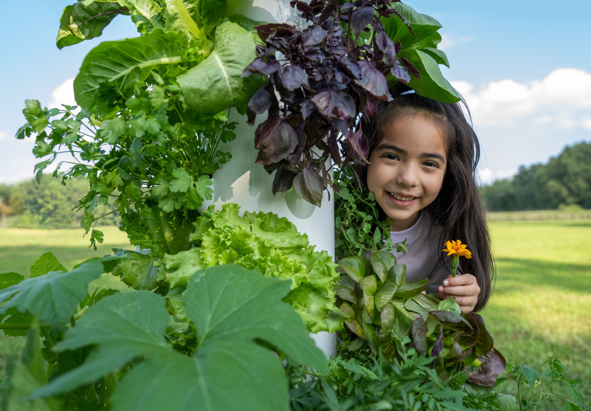 Girl-behind-tower-garden-outdoors