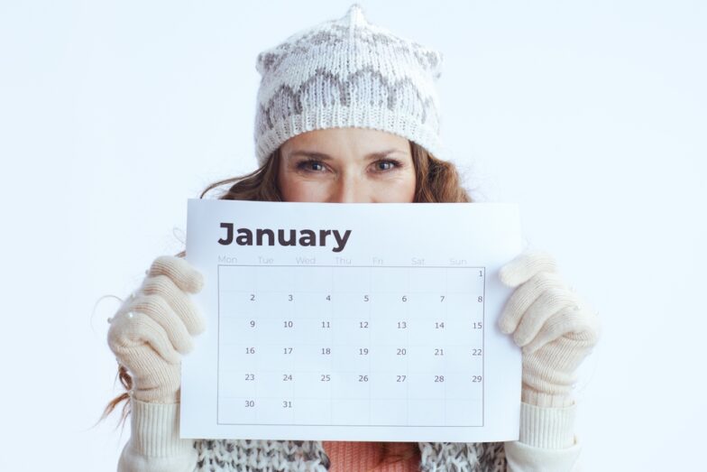 woman-winter-outfit-holding-january-calander-living-her-best-life